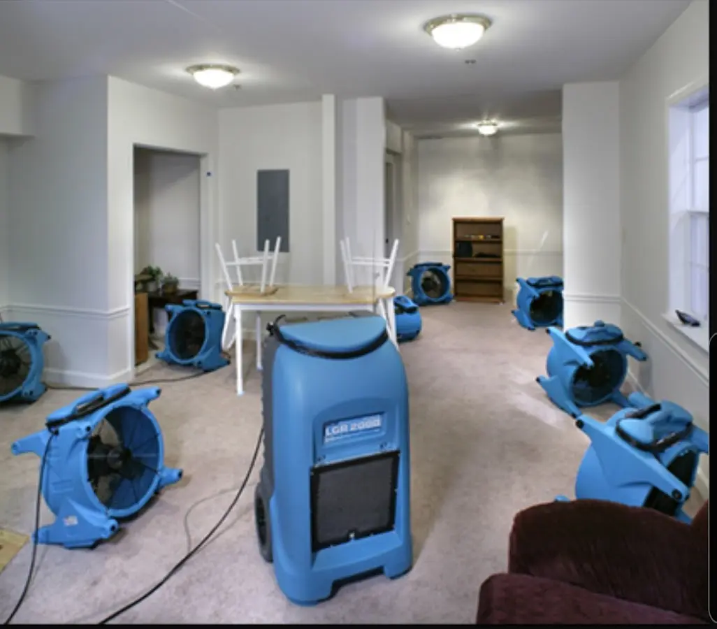 Air movers and dehumidifier setup for Water Damage Restoration in Mantua